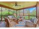 Relaxing screened porch with comfortable seating and stylish patterned rug at 2535 Winthrope Way, Lawrenceville, GA 30044