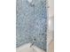 Updated shower stall with blue tiled walls at 2535 Winthrope Way, Lawrenceville, GA 30044