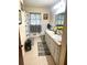 Bright bathroom featuring a double vanity and a tub/shower combo with stylish curtains at 3750 Dial Mill Ne Rd, Conyers, GA 30013