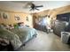 Bedroom featuring a ceiling fan, large window, and dresser at 3750 Dial Mill Ne Rd, Conyers, GA 30013