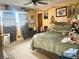Bedroom featuring a ceiling fan, large window, and decorative artwork at 3750 Dial Mill Ne Rd, Conyers, GA 30013