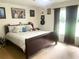 Cozy bedroom featuring a king bed and brightly lit by two large windows at 3750 Dial Mill Ne Rd, Conyers, GA 30013