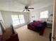 Bedroom featuring a ceiling fan, large window, and neutral paint at 3750 Dial Mill Ne Rd, Conyers, GA 30013