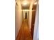 Hallway features hardwood floors, doors, and neutral paint at 3750 Dial Mill Ne Rd, Conyers, GA 30013
