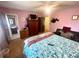 Main bedroom featuring a ceiling fan, large window, and leather sofa at 3750 Dial Mill Ne Rd, Conyers, GA 30013