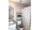 Cozy bathroom features a vanity and toilet with shelving at 40 Pebble Brooke Ct, Covington, GA 30016