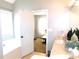 View into bathroom and bedroom with soaking tub and double sink vanity at 40 Pebble Brooke Ct, Covington, GA 30016