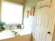 Relaxing bathroom with a soaking tub and decorative accents at 40 Pebble Brooke Ct, Covington, GA 30016