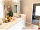 Bathroom featuring double sinks and a neutral color palette at 40 Pebble Brooke Ct, Covington, GA 30016