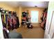 Spacious walk-in closet featuring built in shelving and hanging racks at 40 Pebble Brooke Ct, Covington, GA 30016
