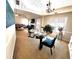 Open-concept dining and living room with modern furnishings and vaulted ceilings at 40 Pebble Brooke Ct, Covington, GA 30016