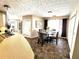 Eat-in kitchen features a glass table, tiled floor, and leads to the backyard with sliding glass door at 40 Pebble Brooke Ct, Covington, GA 30016