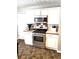 Well-lit kitchen featuring stainless steel appliances and tile backsplash at 40 Pebble Brooke Ct, Covington, GA 30016