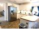 Bright kitchen featuring white cabinetry, stainless steel refrigerator, and tiled floor at 40 Pebble Brooke Ct, Covington, GA 30016