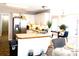 Bright kitchen with stainless steel appliances and a seamless open floorplan to the dining room at 40 Pebble Brooke Ct, Covington, GA 30016