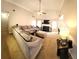 Comfortable living room with a large sectional sofa, fireplace, and a ceiling fan at 40 Pebble Brooke Ct, Covington, GA 30016