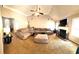 Spacious living room featuring high ceilings, fireplace, and a comfortable sectional sofa at 40 Pebble Brooke Ct, Covington, GA 30016