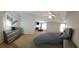 Open-concept primary bedroom with a fireplace, seating area, and a dresser at 40 Pebble Brooke Ct, Covington, GA 30016