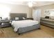 Comfortable main bedroom with a large bed, neutral tones, and plenty of dresser space at 40 Pebble Brooke Ct, Covington, GA 30016