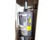 Efficient Rheem water heater with visible Energy Guide information at 40 Pebble Brooke Ct, Covington, GA 30016