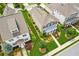 An aerial view highlights the home's well-maintained lawn and lovely landscaping at 4155 Brookview Dr, Cumming, GA 30040