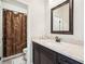 Bathroom featuring a large vanity with a mirror, and a shower with a stylish shower curtain at 4155 Brookview Dr, Cumming, GA 30040