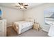 Cozy bedroom featuring a comfortable bed, nightstand, and ample natural light at 4155 Brookview Dr, Cumming, GA 30040