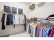 Walk-in closet with ample hanging space and shelving for optimal organization at 4155 Brookview Dr, Cumming, GA 30040