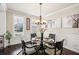 Elegant dining room with stylish decor, a modern chandelier, and ample natural light at 4155 Brookview Dr, Cumming, GA 30040
