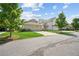 View of the home's attached garages and well-manicured landscaping at 4155 Brookview Dr, Cumming, GA 30040