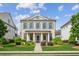 Charming brick home featuring a manicured lawn and a welcoming front porch with elegant columns at 4155 Brookview Dr, Cumming, GA 30040
