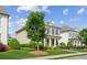 Beautiful home featuring manicured lawn, brick accents, covered porch, and mature landscaping at 4155 Brookview Dr, Cumming, GA 30040