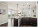 Well-equipped kitchen featuring granite countertops, stainless steel appliances, and open layout to living spaces at 4155 Brookview Dr, Cumming, GA 30040