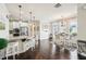 Well-lit eat-in kitchen with bar stool seating and modern appliances at 4155 Brookview Dr, Cumming, GA 30040