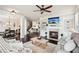 Inviting living room with a fireplace, built-in shelves, and a comfortable seating area at 4155 Brookview Dr, Cumming, GA 30040