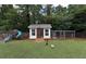Spacious backyard featuring a play set, chicken coop, and ample green space at 5 White Pines Dr, Dallas, GA 30157