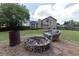 Backyard fire pit with built in chairs at 5 White Pines Dr, Dallas, GA 30157