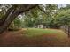 Expansive backyard featuring a shed, wooden playset, chicken coop, and full wooden perimeter fence at 5 White Pines Dr, Dallas, GA 30157