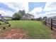 Spacious backyard featuring lawn, playset and a few chickens at 5 White Pines Dr, Dallas, GA 30157