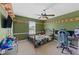 Olive bedroom featuring a bed with a teddy bear, chair, and a desk for studying at 5 White Pines Dr, Dallas, GA 30157