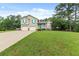 Charming two-story home with a well-manicured lawn, two-car garage, and welcoming front porch at 5 White Pines Dr, Dallas, GA 30157