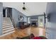 Living room with wood floors, fireplace, and stairs to the second floor at 5 White Pines Dr, Dallas, GA 30157