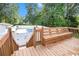 Outdoor back deck with wooden bench overlooking fenced in backyard at 108 Faraday Dr, Douglasville, GA 30134