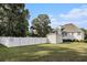 Spacious backyard with mature trees and manicured lawn at 108 Faraday Dr, Douglasville, GA 30134