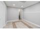 Finished room with neutral paint, recessed lighting and patterned tile flooring at 108 Faraday Dr, Douglasville, GA 30134