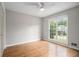 Bedroom with hardwood floors, a ceiling fan, and large windows at 108 Faraday Dr, Douglasville, GA 30134