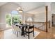 Bright dining room with large windows and modern chandelier at 108 Faraday Dr, Douglasville, GA 30134