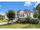 Charming two-story home with white siding, beautiful landscaping and a well-maintained lawn at 108 Faraday Dr, Douglasville, GA 30134