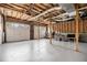 Spacious three-car garage with exposed ceiling at 108 Faraday Dr, Douglasville, GA 30134