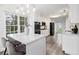 Modern kitchen with large windows, breakfast bar, and stainless steel appliances at 108 Faraday Dr, Douglasville, GA 30134